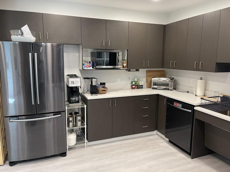 Office kitchen with counters and appliances wiped down