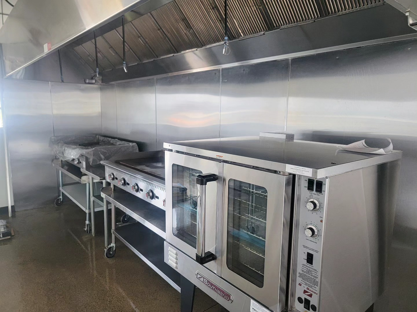 New commercial kitchen line and hood cleaned ahead of handover